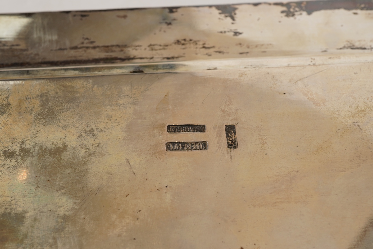 An early 20th century Chinese Export white metal two handled rectangular tea tray, by Luen Wo, Shanghai, with engraved presentation inscription, 'Presented to Captain John Whittle by the undersigned China Navigation Cos.